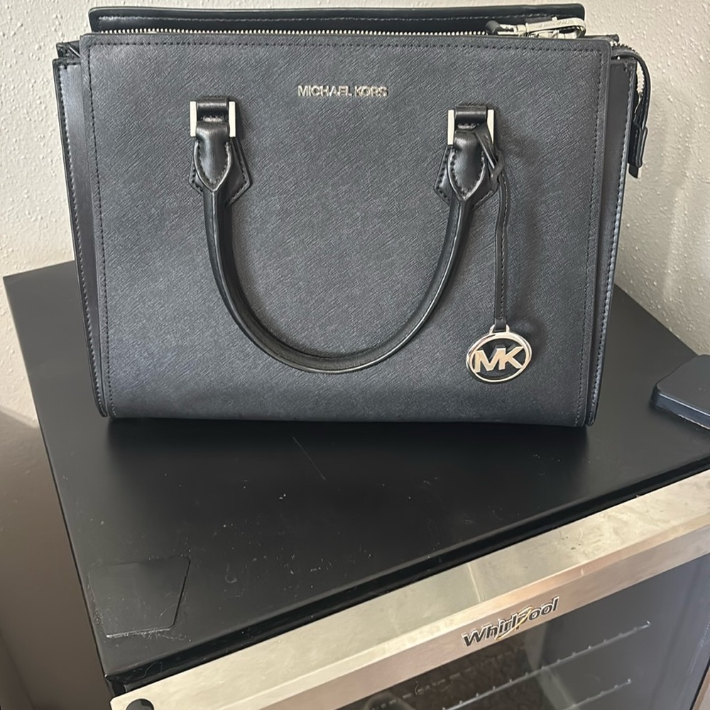 Michael Kors Black Tote with Silver Accents and white bag